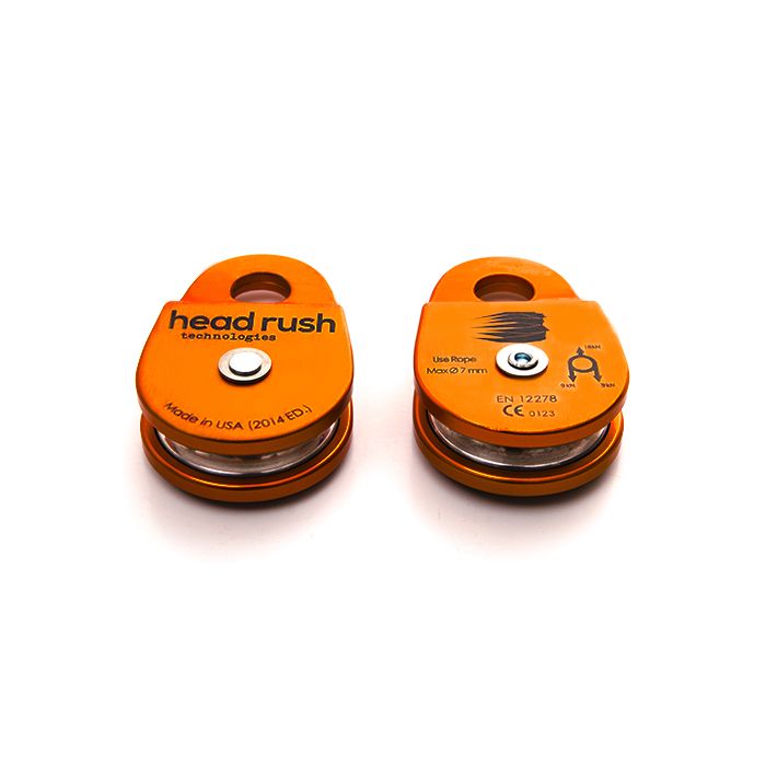 front and back of orange zipSTOP redirection zip line pulley for zip line redirection lines