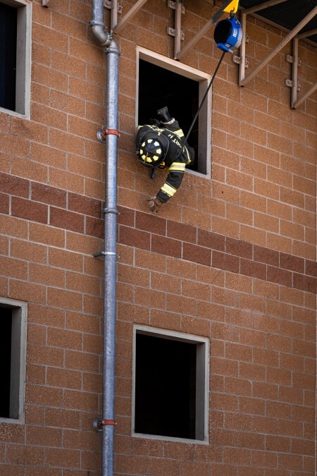 Firefighters performing at-height training using TruBlue SafeLine controlled descent
