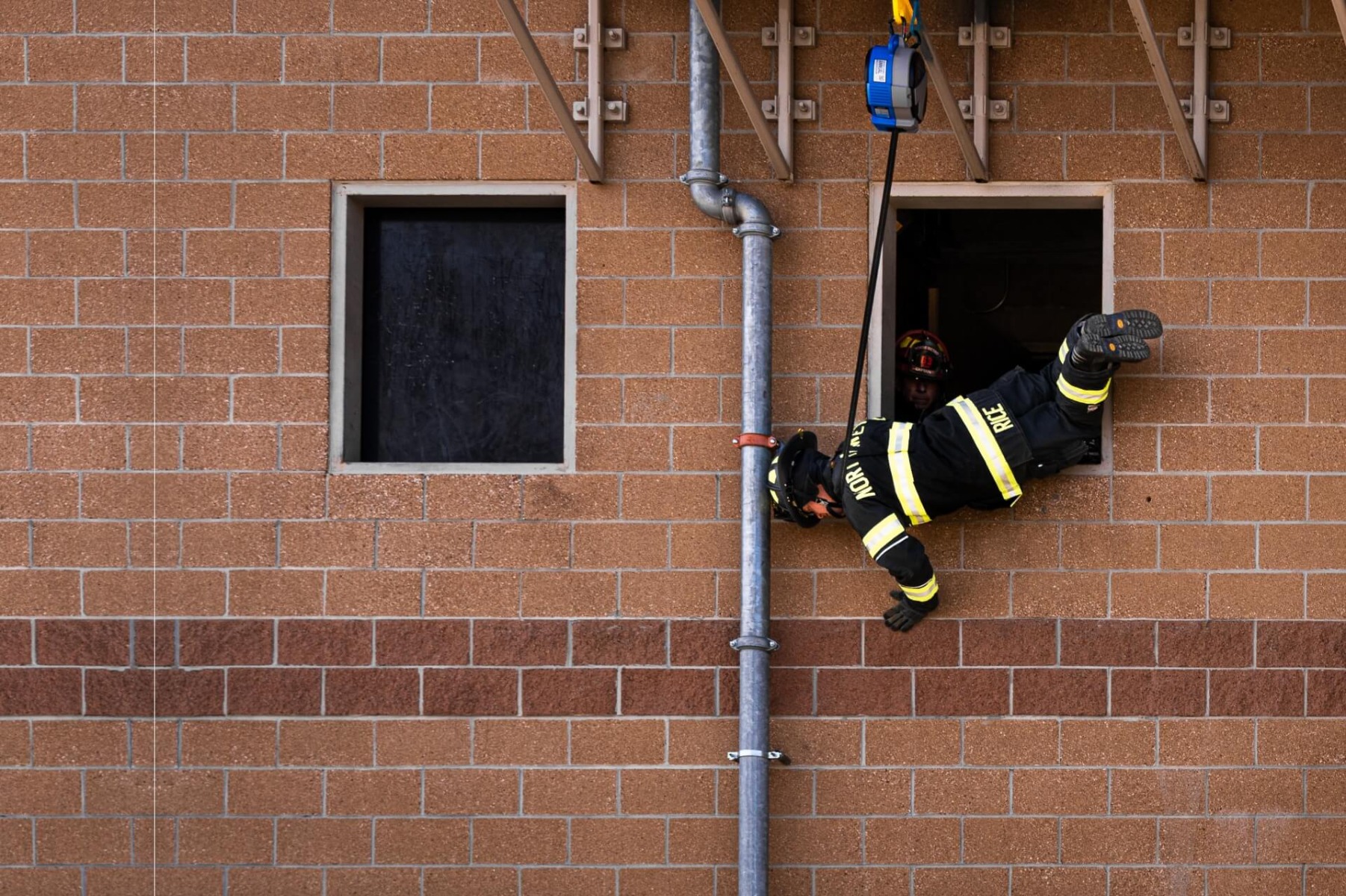 Firefighters training at height using TruBlue SafeLine controlled descent system