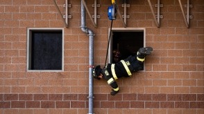 Firefighters using TruBlue SafeLine for controlled descent training at height