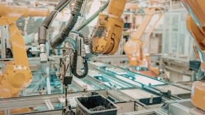 Industrial robotic arms on a production line