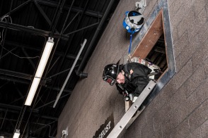 Firefighter performing a ladder bailout using TruBlue SafeLine during training