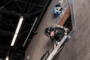 Firefighter performing a ladder bailout using TruBlue SafeLine during training