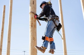 An experienced lineworker shows an example of what to do while cutting out on a pole