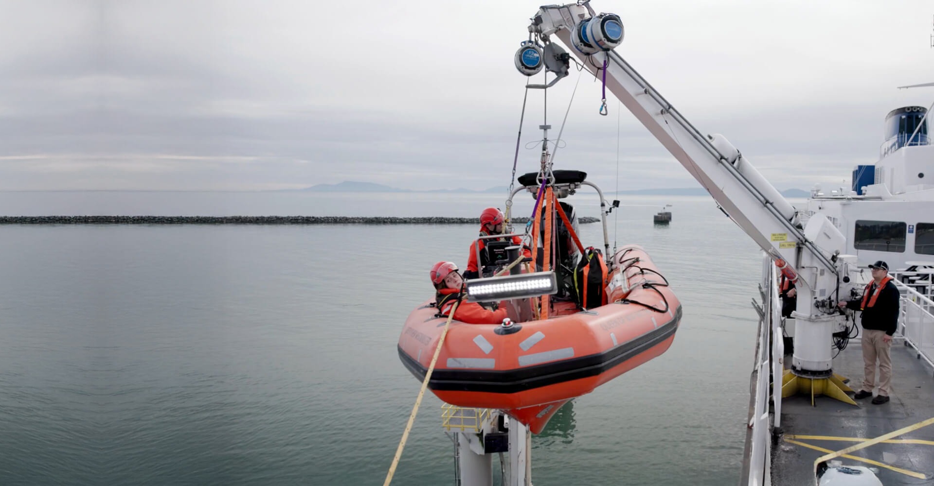 Worker performing maritime training at height using TruBlue SafeLine controlled descent system