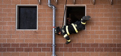 Firefighters training at height using TruBlue SafeLine for window bailout