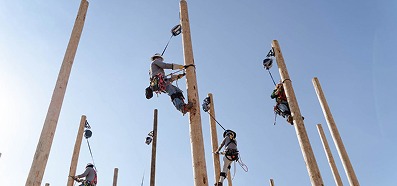Utility worker climbing and training at height with TruBlue SafeLine safety system