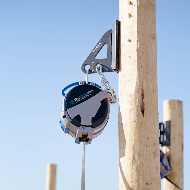 Close up photo of a TruBlue SafeLine Controlled Descent Device mounted on a utilities pole
